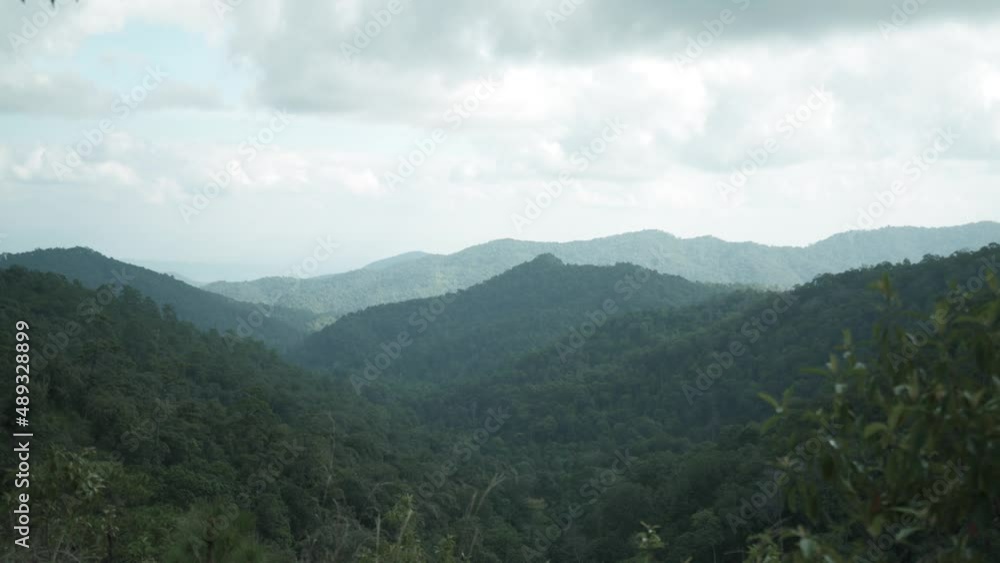 Overlapping high mountain with cloudy sky Overlapping high mountain with cloudy sky