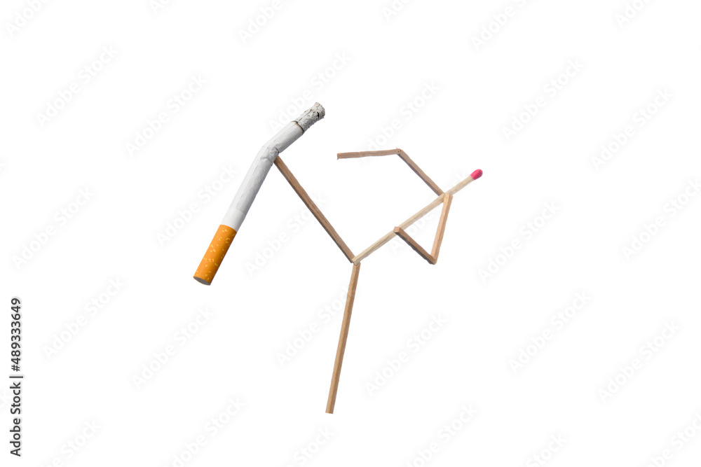 Quit Smoking Concept - match man kicks off a cigarette Quit Smoking Concept - match man kicks off a cigarette
