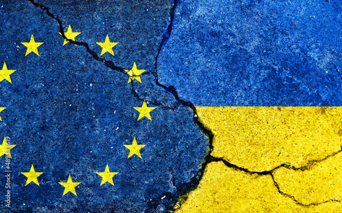 EU vs Ukraine (War crisis , Political conflict). Grunge country flag illustration (cracked concrete background)