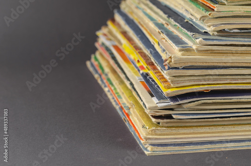 Collection of old comics and magazines against a gray background.