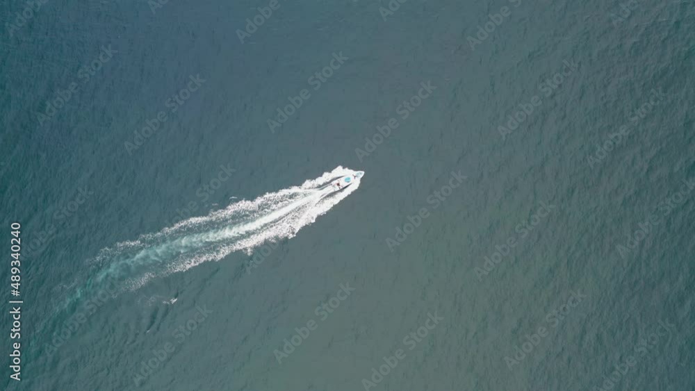 A speed boat is riding on the pacific filmed by a drone A speed boat is riding on the pacific filmed by a drone
