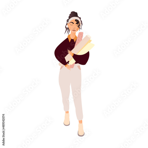 A female designer holds wallpaper in her hands