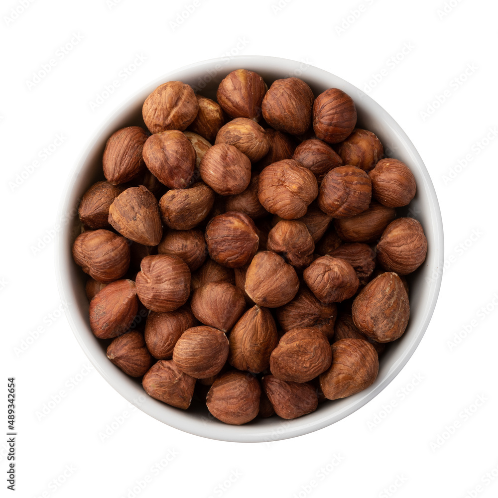 Hazelnuts in a bowl isolated over white background Hazelnuts in a bowl isolated over white background