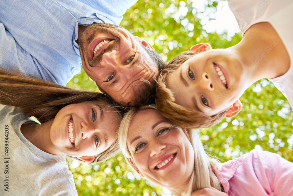 Parents and children as a happy family in summer Stock Photo | Adobe Stock