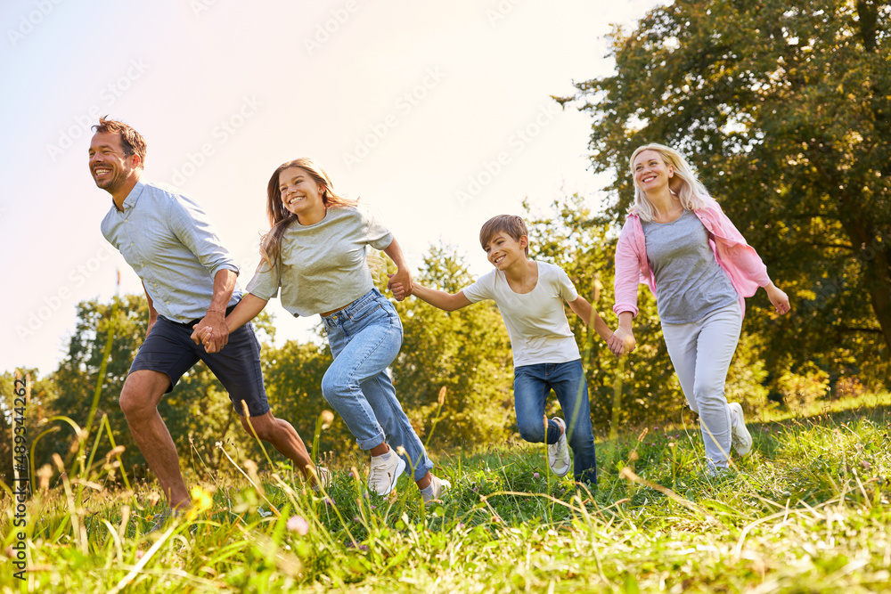 Happy family with two children running Happy family with two children running