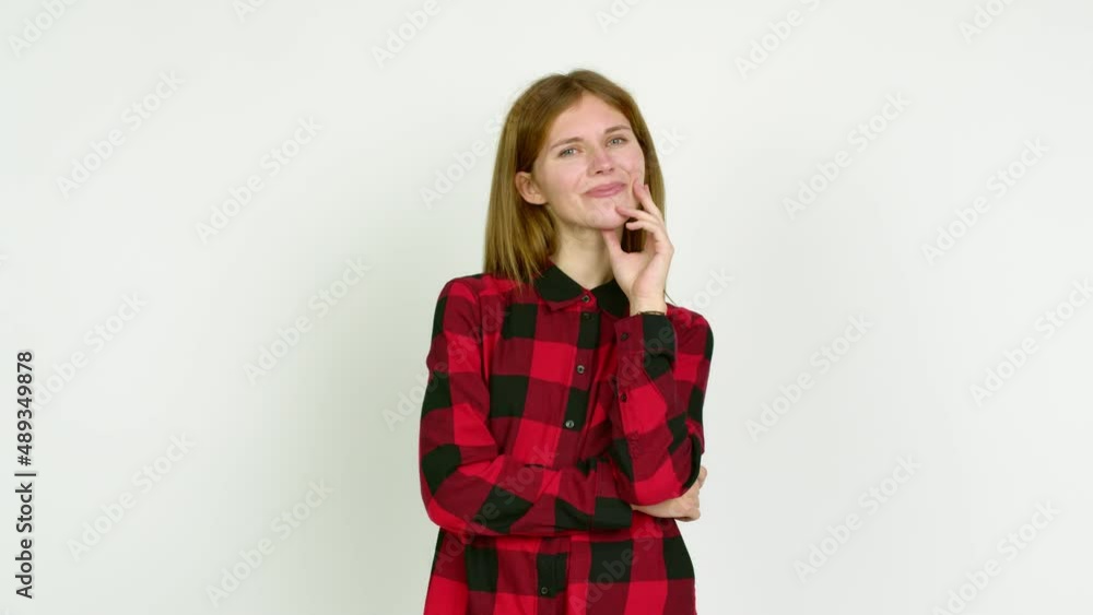 Young woman smiling and looking to the front with confident face over isolated background Young woman smiling and looking to the front with confident face over isolated background