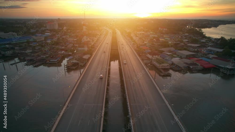 4K Hyper lapse : Drone fly over the bridge and a river. horizon at sunrise. Aerial view from drone. thailand
4K Hyper lapse : Drone fly over the bridge and a river. horizon at sunrise. Aerial view from drone. thailand