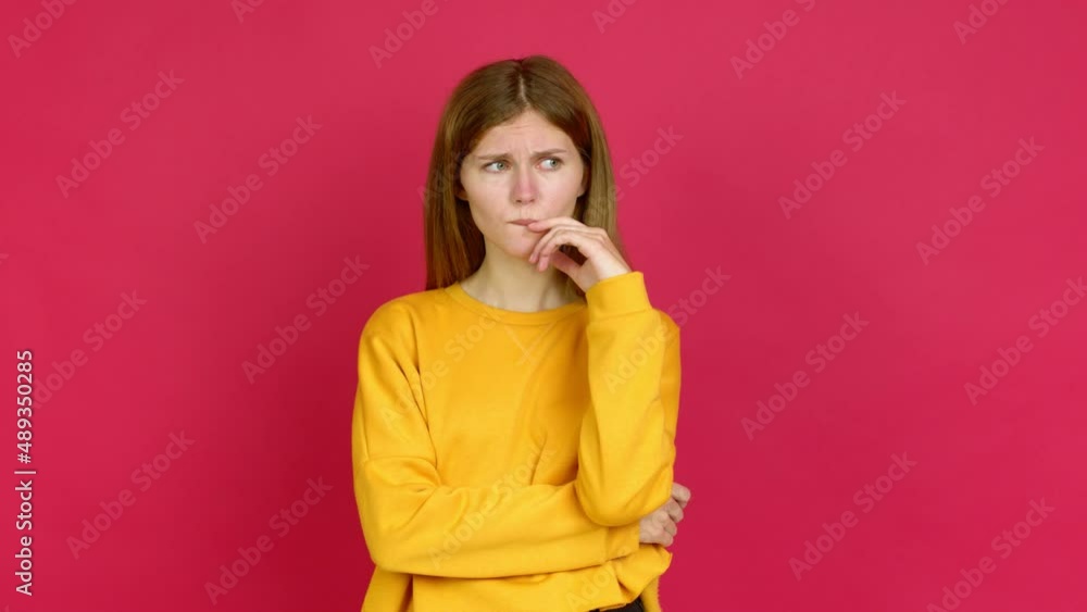 Young woman having doubts and questioning an idea over isolated background Young woman having doubts and questioning an idea over isolated background