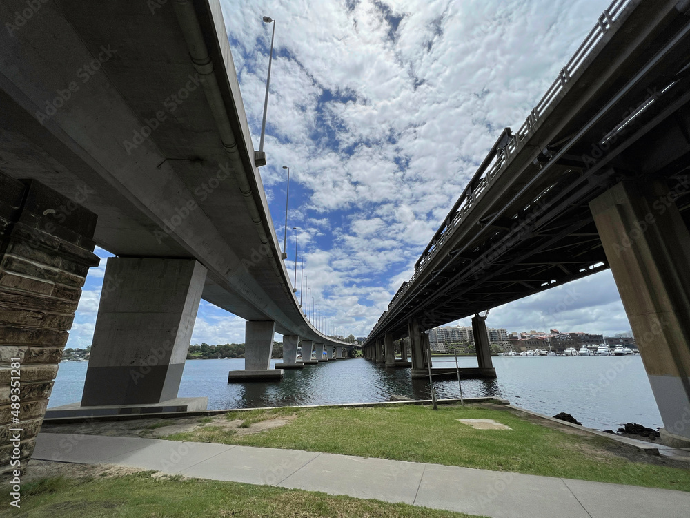 View between two bridges, Iron Cove Creek pedestrian bridge and Iron Cove Bridge at Bay Run, Sydney NSW Australia View between two bridges, Iron Cove Creek pedestrian bridge and Iron Cove Bridge at Bay Run, Sydney NSW Australia