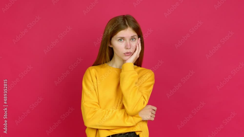 Young woman gaping because have just surprised with a gift over isolated background Young woman gaping because have just surprised with a gift over isolated background