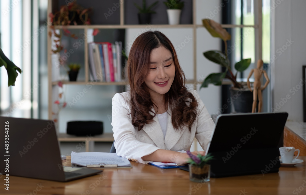 Business asian woman using laptop computer at her office Business asian woman using laptop computer at her office