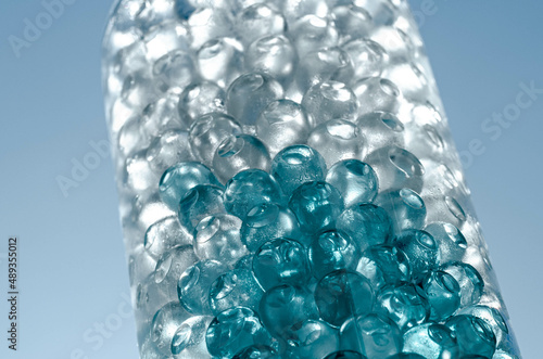 Hydrogel balls in a glass vase. Hydrogel as an art object or background for a computer desktop. Hydrogel close-up.