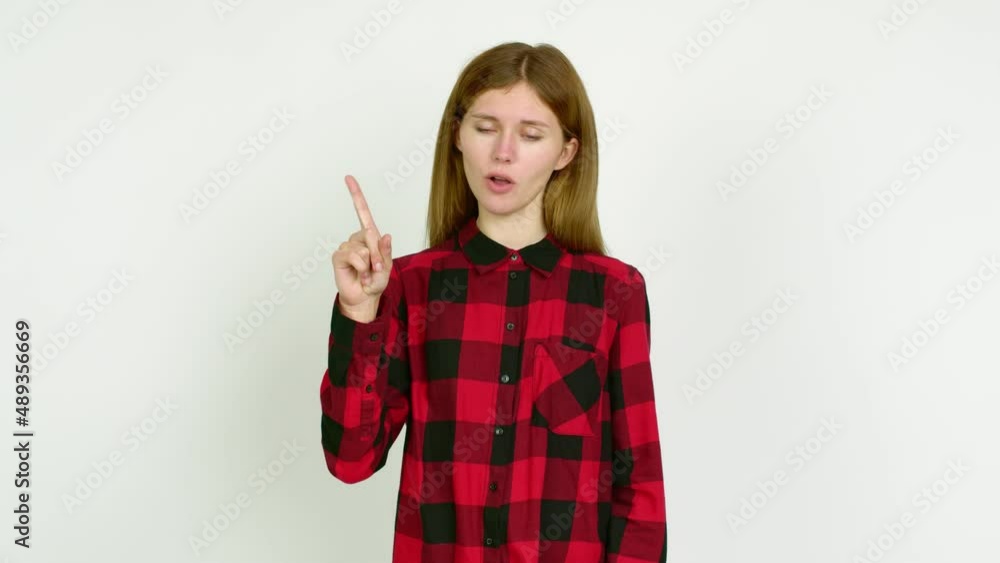 Young woman doing NO gesture over isolated background Young woman doing NO gesture over isolated background