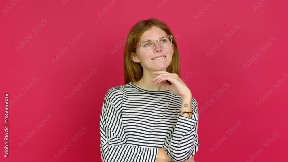 Young woman with glasses and looking up Young woman with glasses and looking up