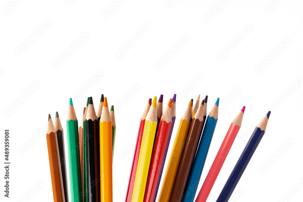 Many multicolored pencils, isolated on white background with copy space. Art and education background. Many multicolored pencils, isolated on white background with copy space. Art and education background.