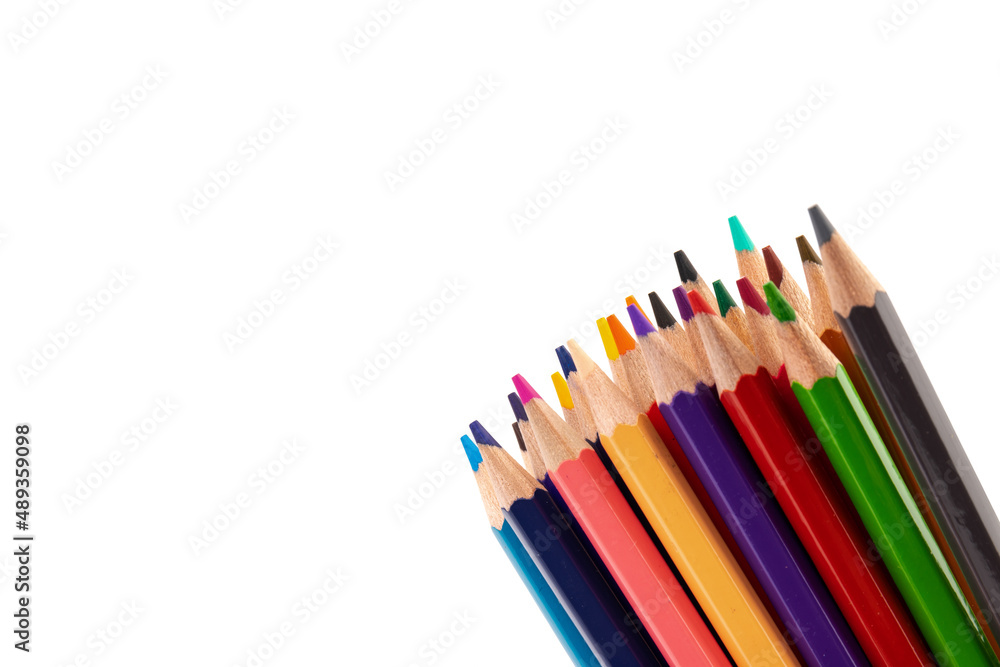 Many multicolored pencils, isolated on white background with copy space. Art and education background. Many multicolored pencils, isolated on white background with copy space. Art and education background.