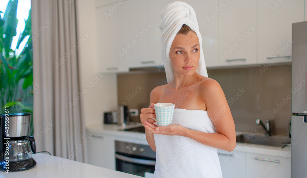 Young beautiful girl in the morning with a cup of coffee Young beautiful girl in the morning with a cup of coffee