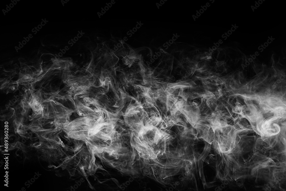 Smoke over black background. Fog or steam texture. Smoke over black background. Fog or steam texture.