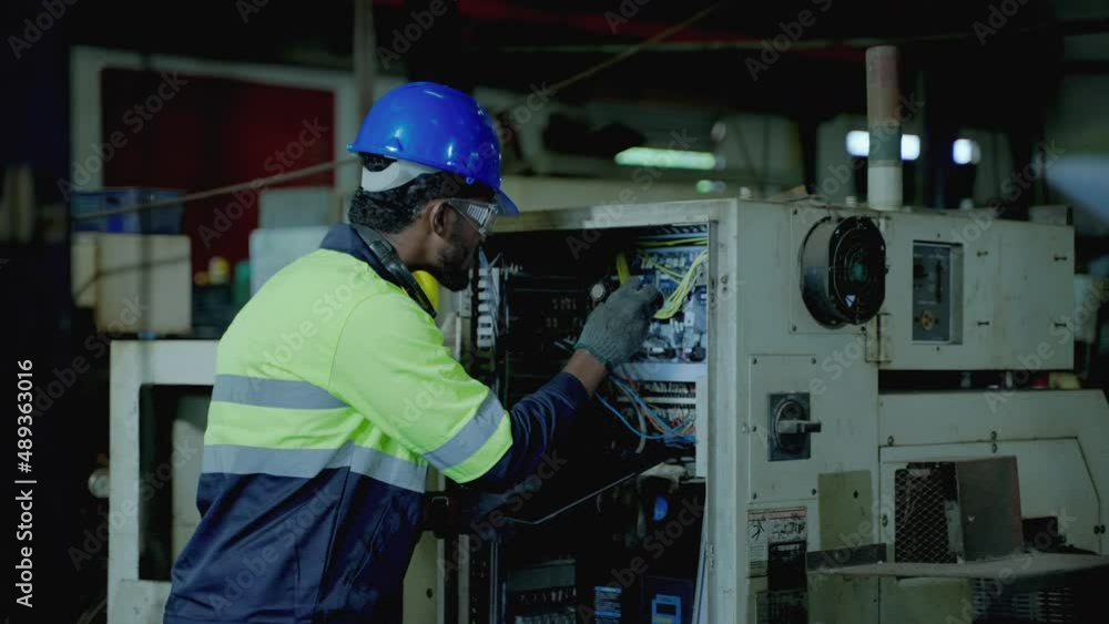 Caucasian maintenance engineer is using a torch to light a control cabinet to maintain normal operation in an industrial facility.
Caucasian maintenance engineer is using a torch to light a control cabinet to maintain normal operation in an industrial facility.
