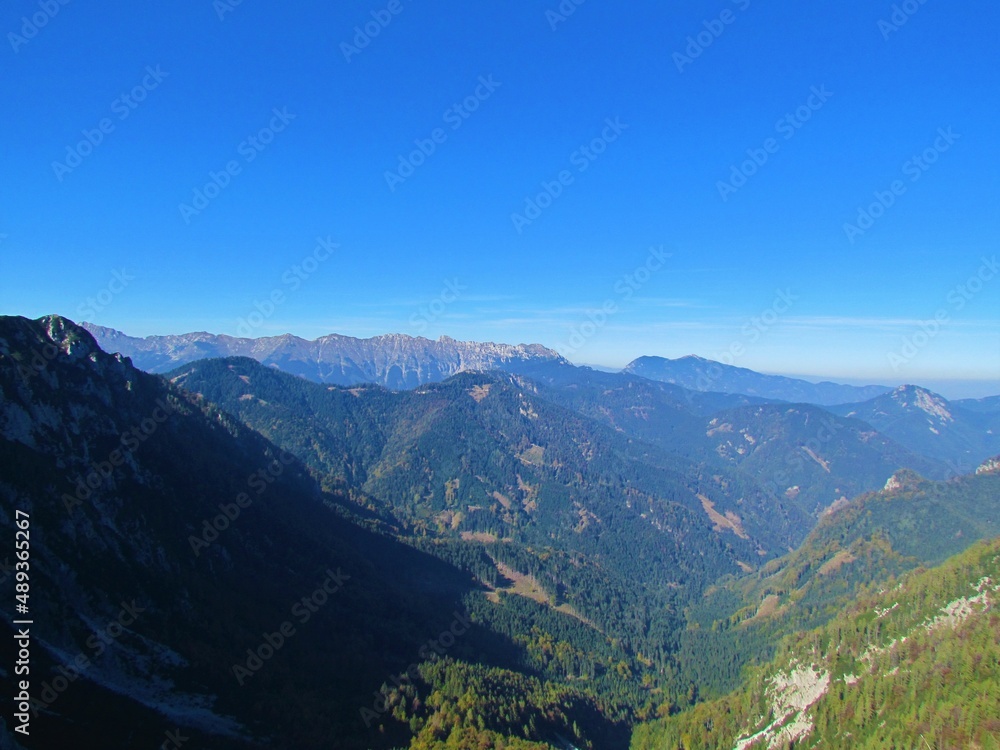 Beautiful scenic view of the mountains and hills in the Karavanke mountains in Gorenjska region of Slovenia on a clear sunny day