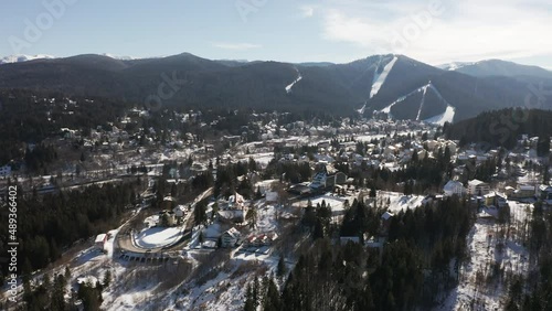 Aerial view over town of Predeal, Romania; Clabucet Mountains in distance. photo