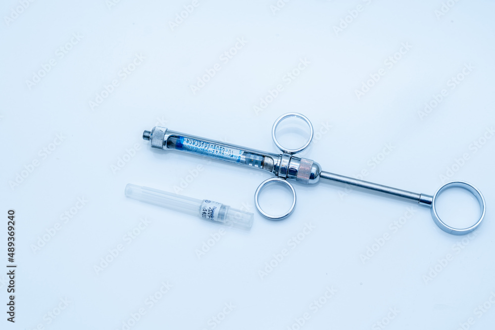Dental syringe on table in dental office Dental syringe on table in dental office