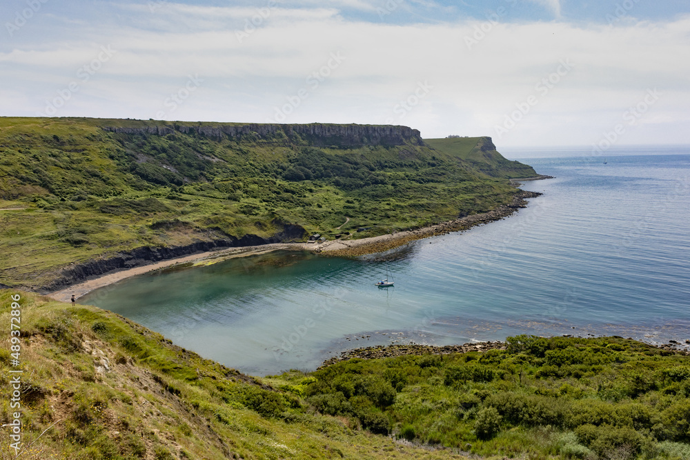 Sail boat moored in Chapman's Pool viewed from Egmont Point on the Dorset stretch of the South West Coast Path Sail boat moored in Chapman's Pool viewed from Egmont Point on the Dorset stretch of the South West Coast Path