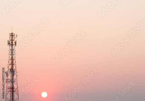 Fototapeta Transmission tower with sunset in the evening, wide of sunset view