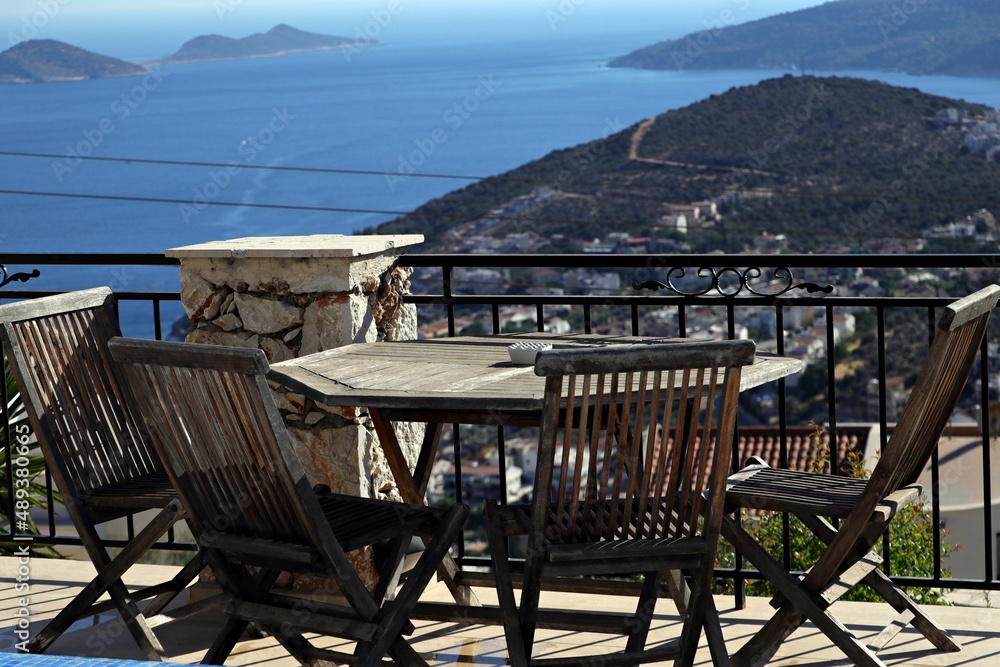 Stunning sea view and wooden seating in the garden in a villa in Antalya's 'Kaş' district
