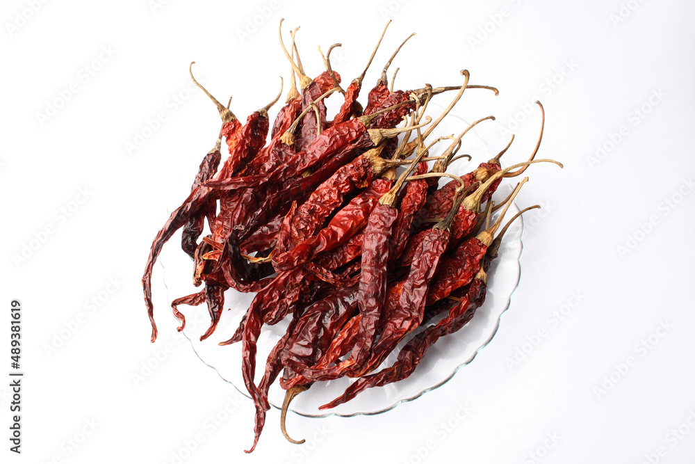 Fototapeta premium Dried red chillies on a white background