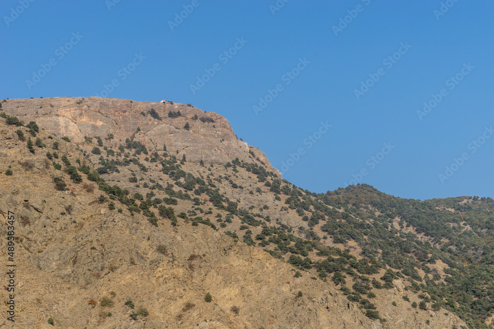 Seascape with a view of the rocky coastline. Seascape with a view of the rocky coastline.