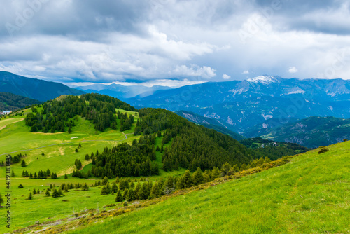 A picturesque landscape view of the French Alps mountains on a cloudy summer day (Valberg, Alpes-Maritimes, France)