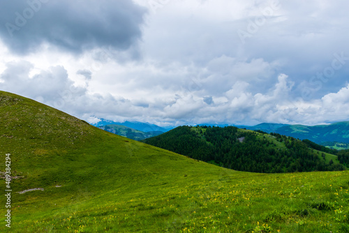 A picturesque landscape view of the French Alps mountains on a cloudy summer day (Valberg, Alpes-Maritimes, France)