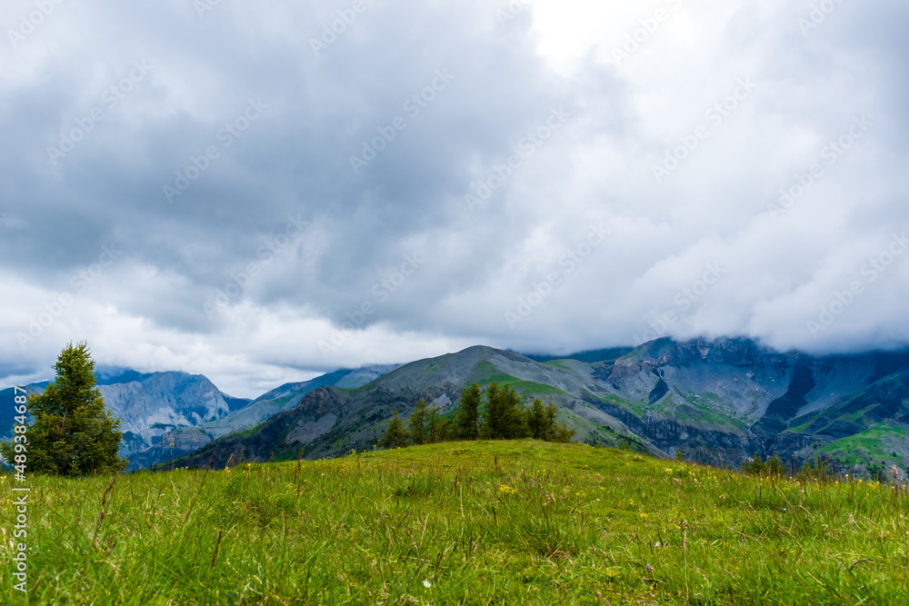 Fototapeta premium A picturesque landscape view of the French Alps mountains on a cloudy summer day (Valberg, Alpes-Maritimes, France)