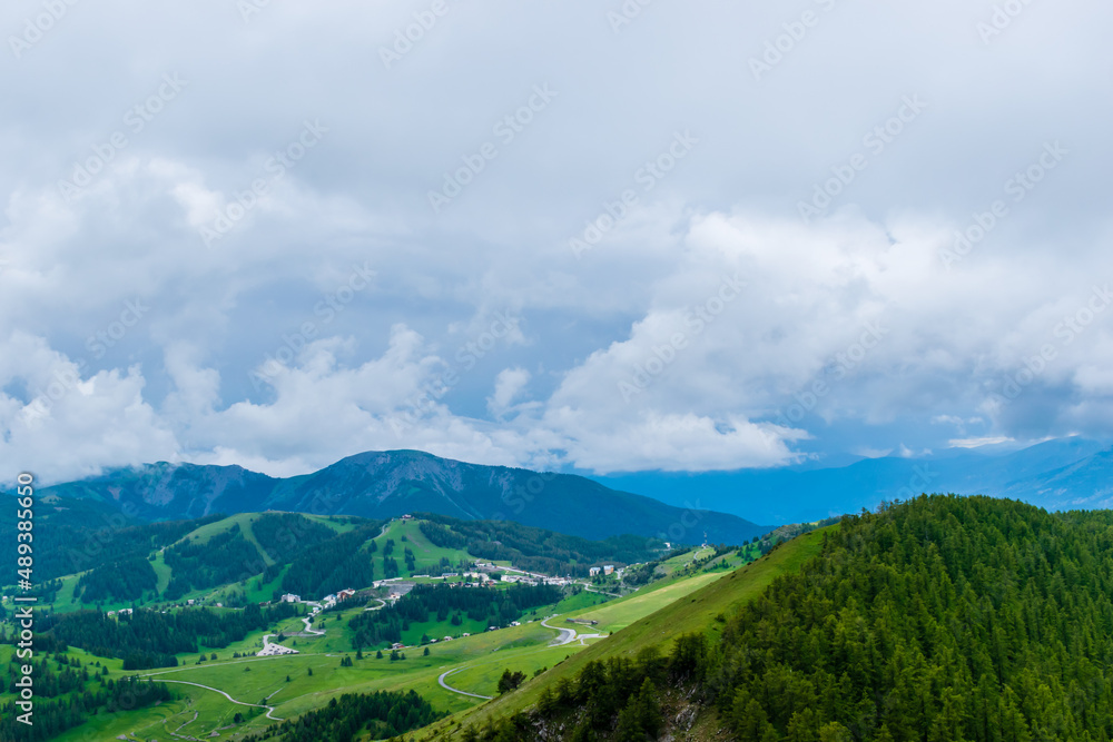 A picturesque landscape view of the French Alps mountains on a cloudy summer day (Valberg, Alpes-Maritimes, France)