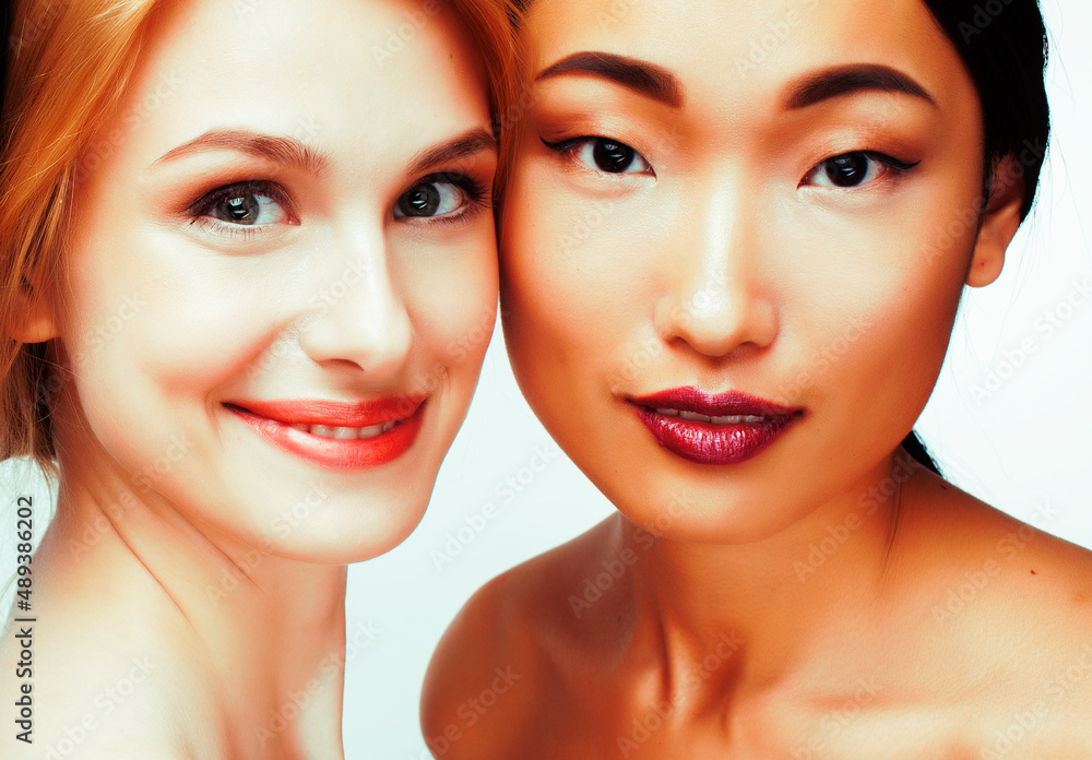 different nation woman: caucasian and asian together isolated on white background happy smiling, diverse type on skin, lifestyle people concept