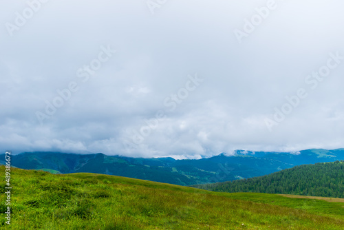 A picturesque landscape view of the French Alps mountains on a cloudy summer day (Valberg, Alpes-Maritimes, France)