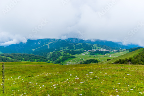 A picturesque landscape view of the French Alps mountains on a cloudy summer day (Valberg, Alpes-Maritimes, France)
