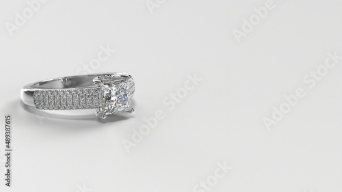 princess white gold engagement ring with side three layer stones on shank laying down © CADjewels