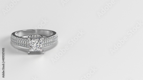 princess white gold engagement ring with side three layer stones on shank laying down front