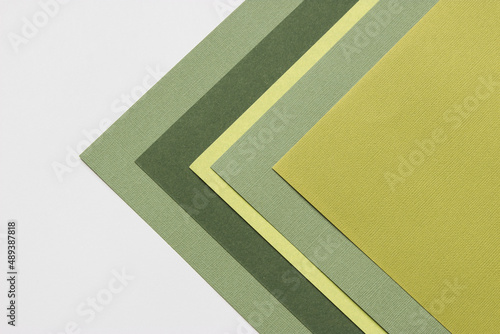 Multilayered colored cardstock background geometric design top view.