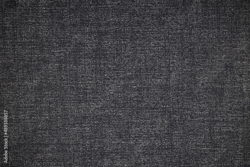 Strange Black and White texture pattern. Vivid dark blue background checks background. Shades of Grey cloth or Fabric with vignette. 