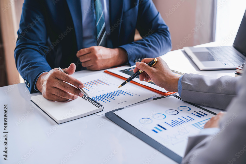 Business team working on new startup projects. Discuss the analysis of charts and graphs showing investment performance reports. and profit accounting and finance business ideas Business team working on new startup projects. Discuss the analysis of charts and graphs showing investment performance reports. and profit accounting and finance business ideas