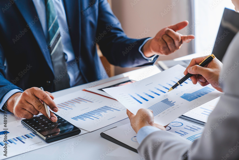 Business team working on new startup projects. Discuss the analysis of charts and graphs showing investment performance reports. and profit accounting and finance business ideas Business team working on new startup projects. Discuss the analysis of charts and graphs showing investment performance reports. and profit accounting and finance business ideas