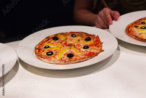 Round pizza white table portion.