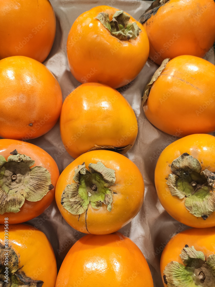 Fresh orange Persimon fruit .Kaki fruits on market Fresh orange Persimon fruit .Kaki fruits on market