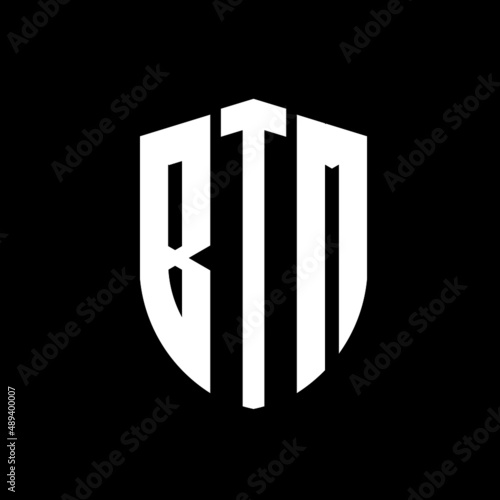 BTM letter logo design. BTM modern letter logo with black background. BTM creative  letter logo. simple and modern letter logo. vector logo modern alphabet font overlap style. Initial letters BTM  photo