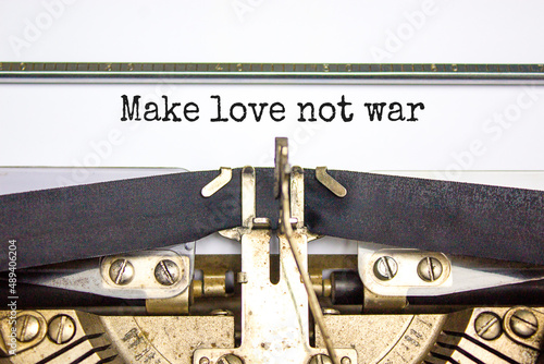 Make love not war symbol. Concept words Make love not war typed on retro typewriter. Beautiful white background. Make love not war business concept. Copy space.