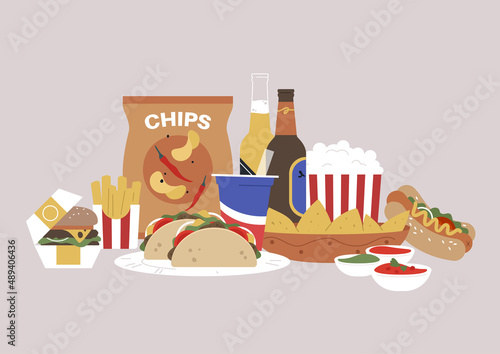 A fast food set, sandwiches, chips, french fries, soda, beer, popcorn, nachos, and sauces