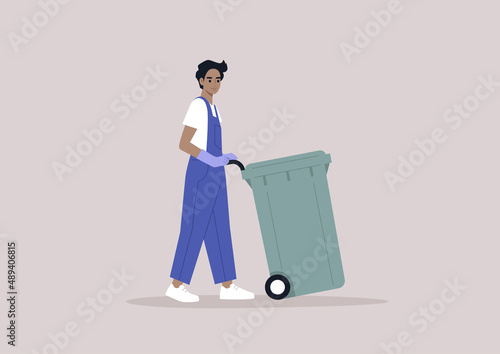 A young modern character in denim overalls collecting a waste bin, Utility service, environmental conversation, a plastic garbage container on a wheel